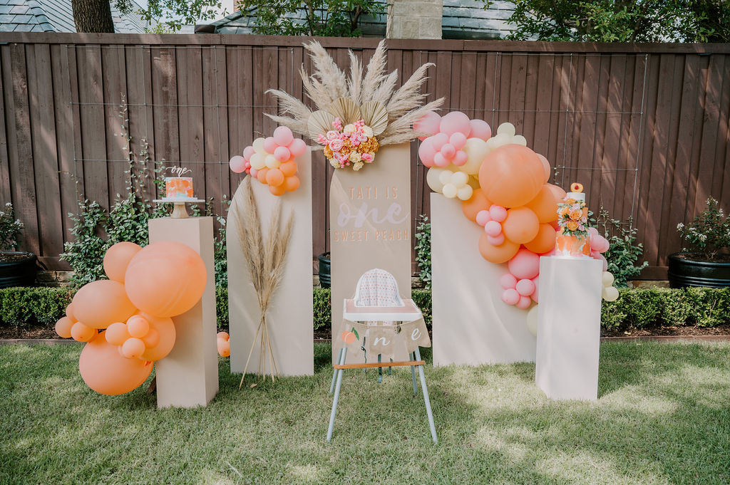 cake smash setup for one sweet peach themed first birthday party featuring The Styled Affair