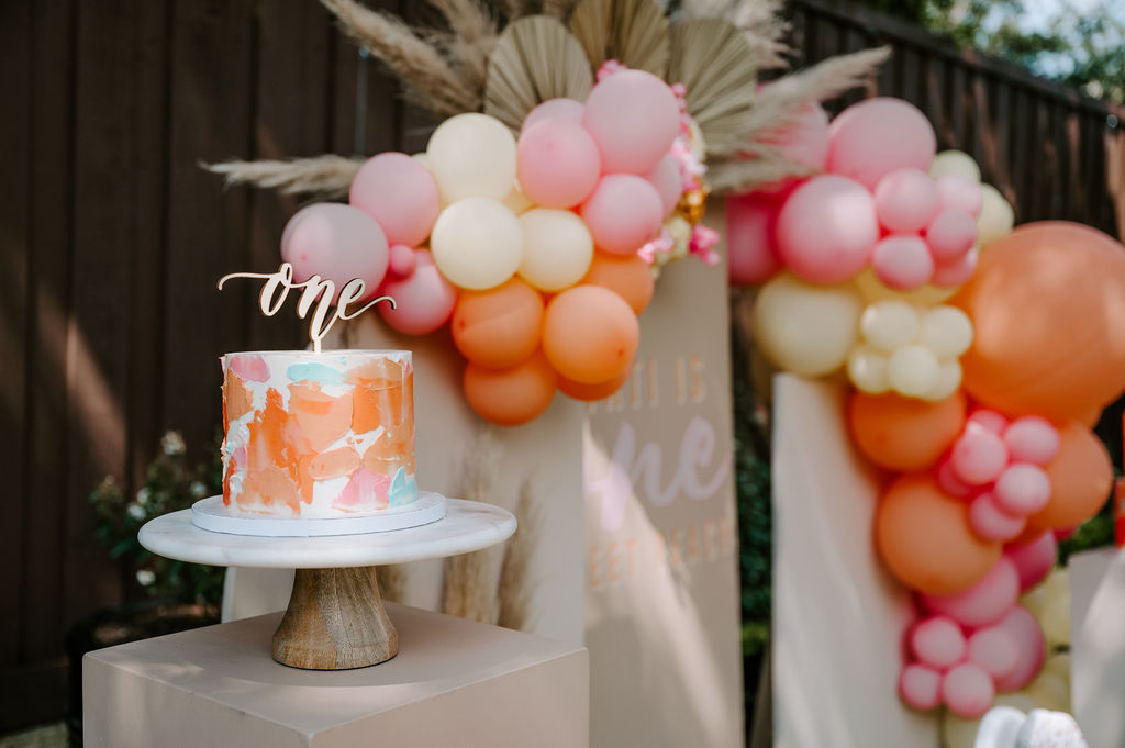 modern cake smash for one sweet peach themed first birthday party